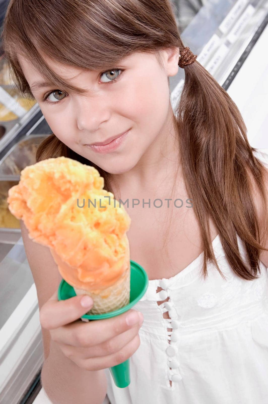 Portrait of a girl holding an ice cream