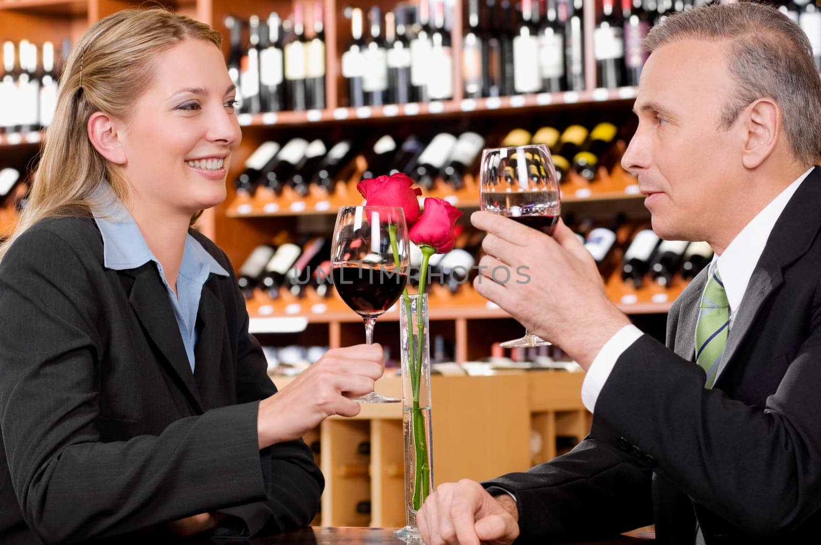 Two business executives toasting with wine