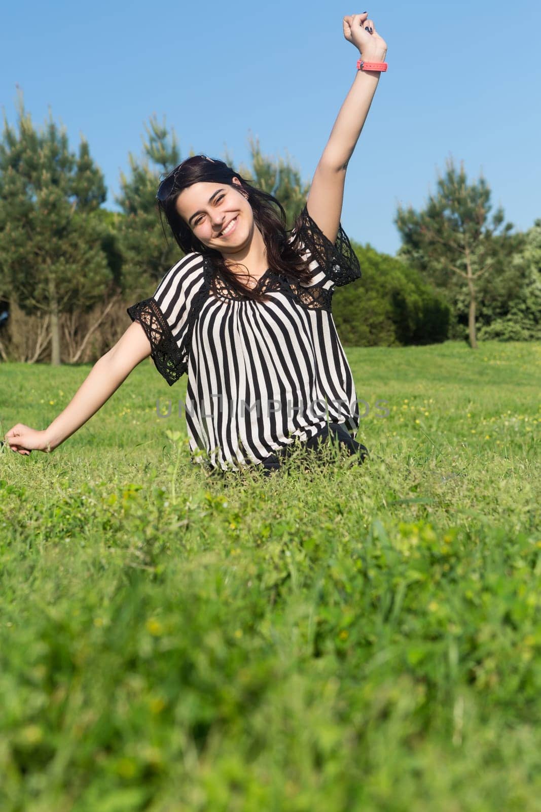 A beautiful young woman relaxing at the city park