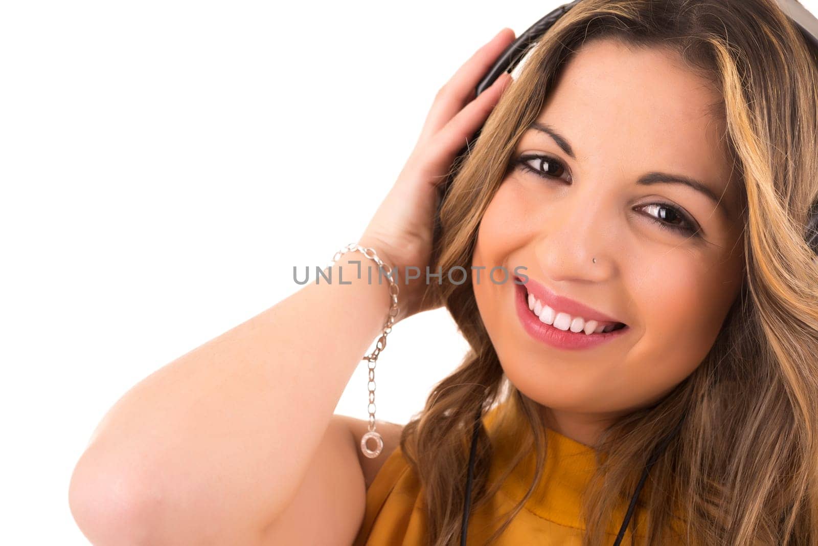 Happy young woman listening to music