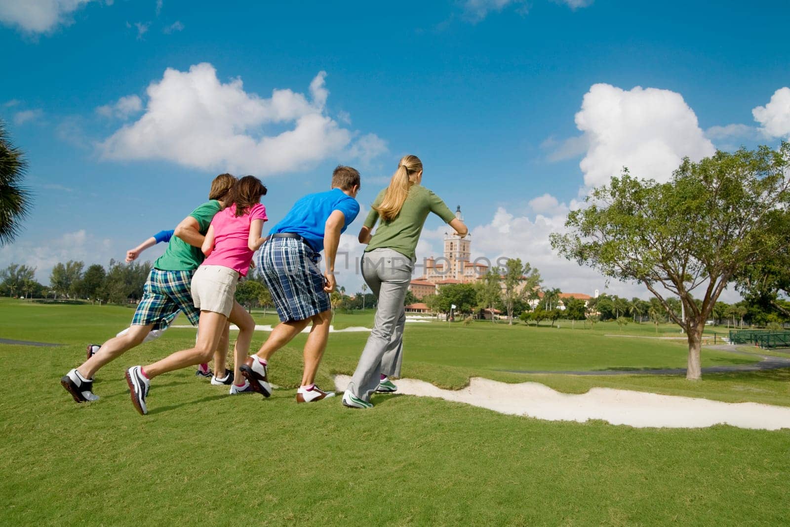 Five friends having fun in a golf course, Biltmore Golf Course, Coral Gables, Florida, USA
