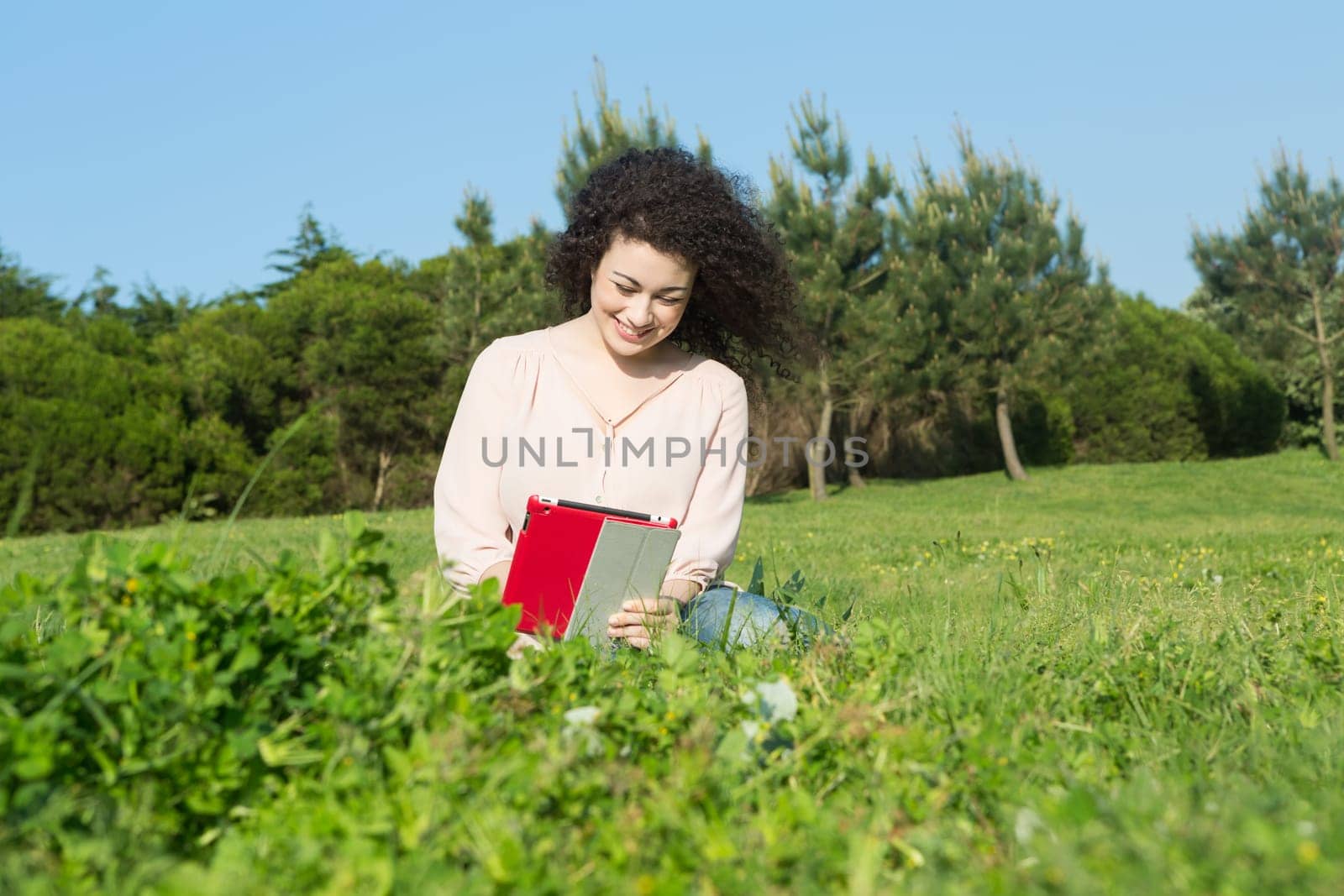 A beautiful young woman relaxing at the city park
