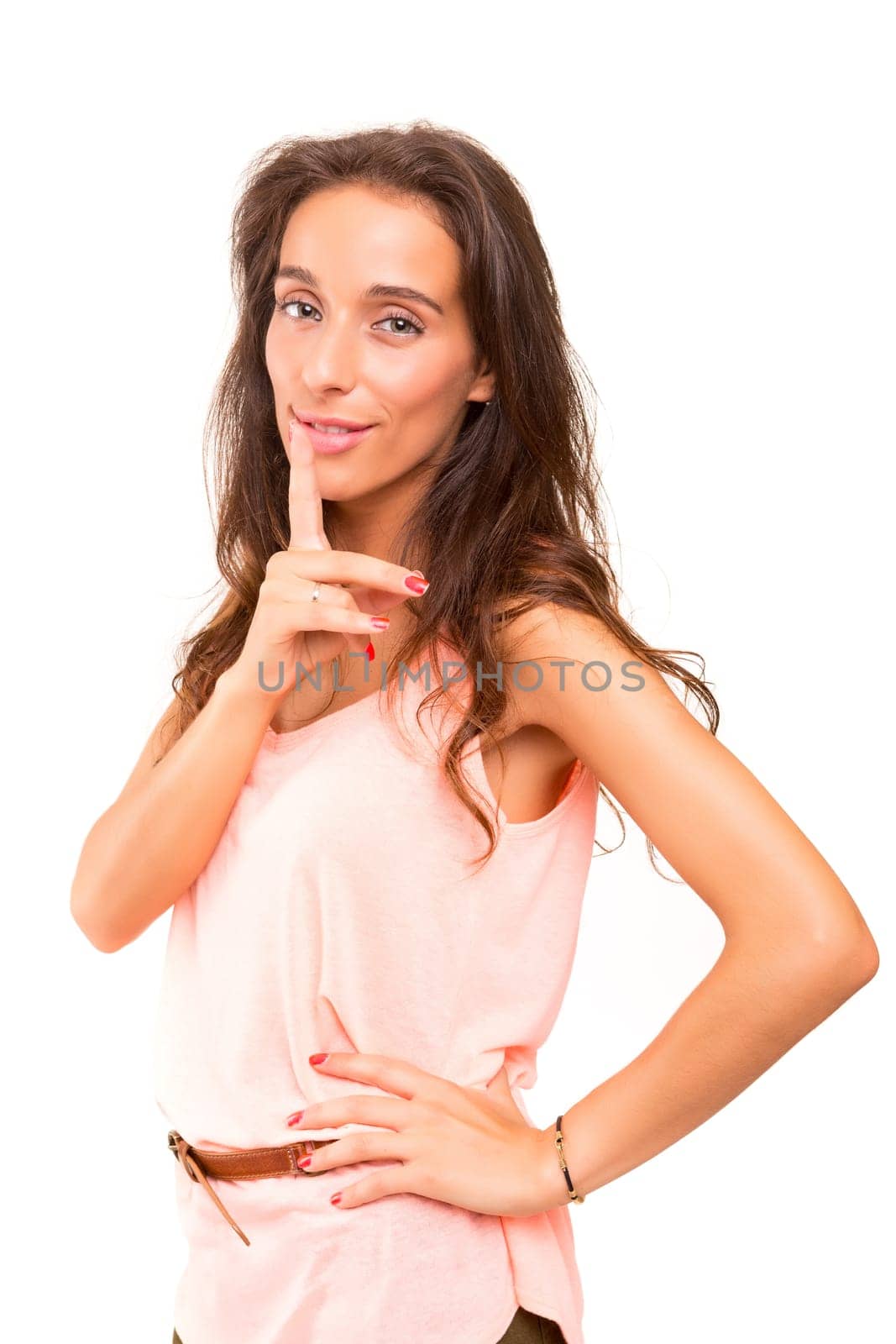 Beautiful woman with finger in front of her mouth asking for silence / less noise