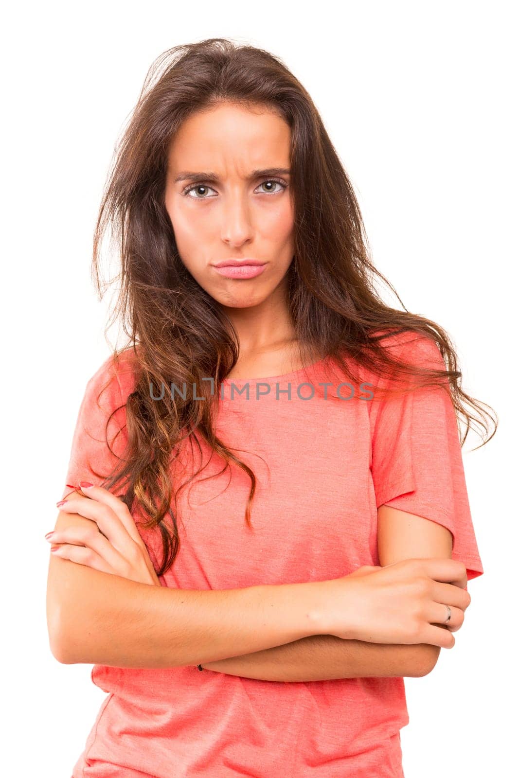 Sad woman posing over a white background