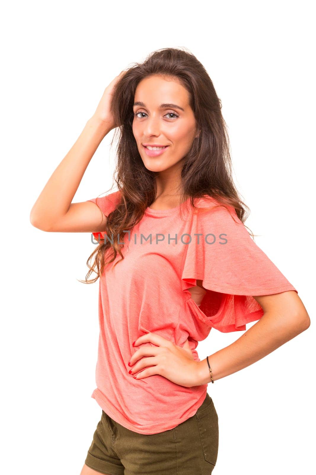 Beautiful young woman posing isolated over white background