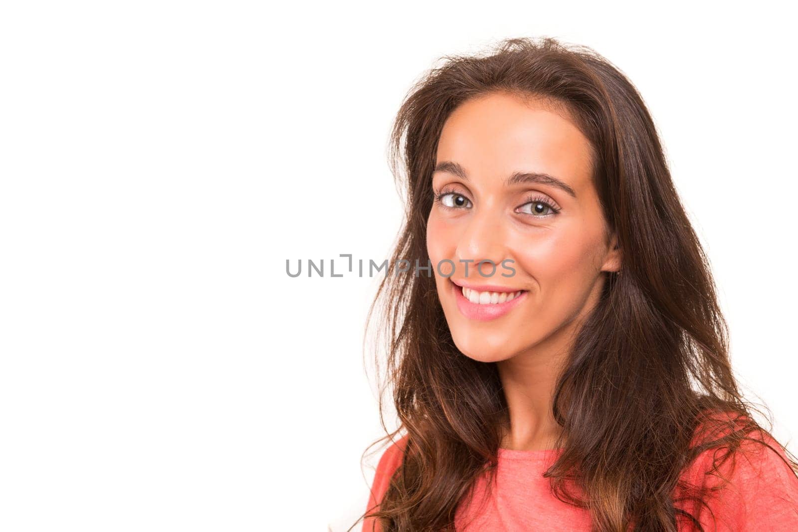 Beautiful young woman posing isolated over white background