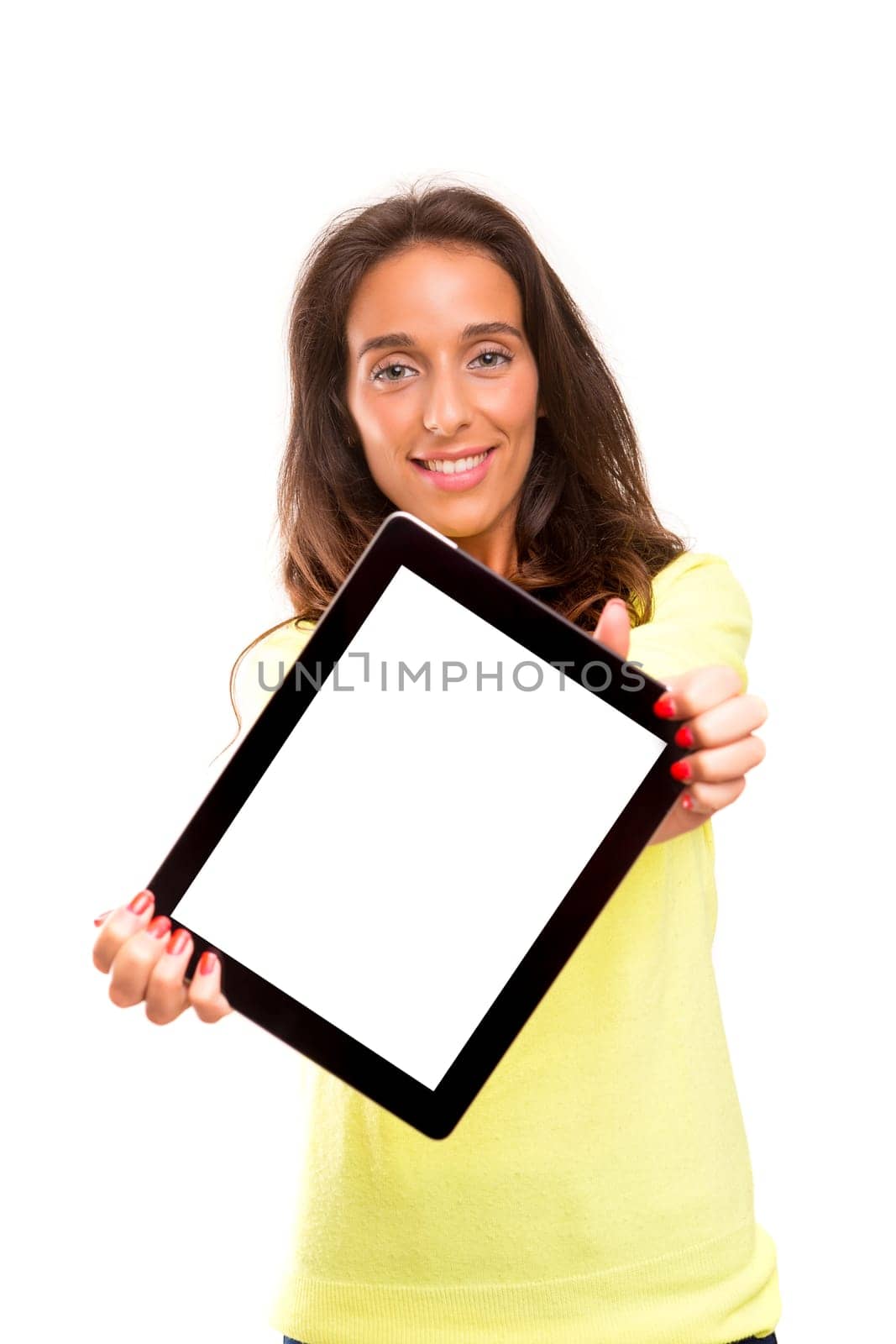 Happy young woman presenting your product in a tablet computer
