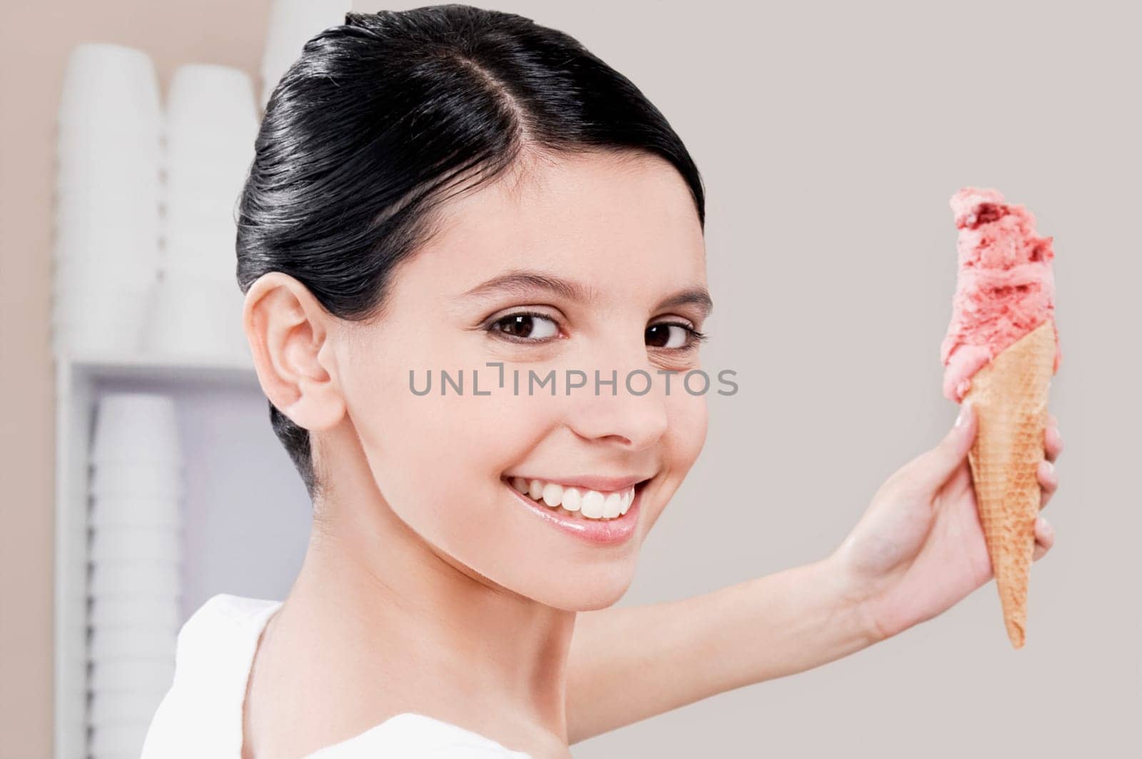 Teenage girl holding an ice cream