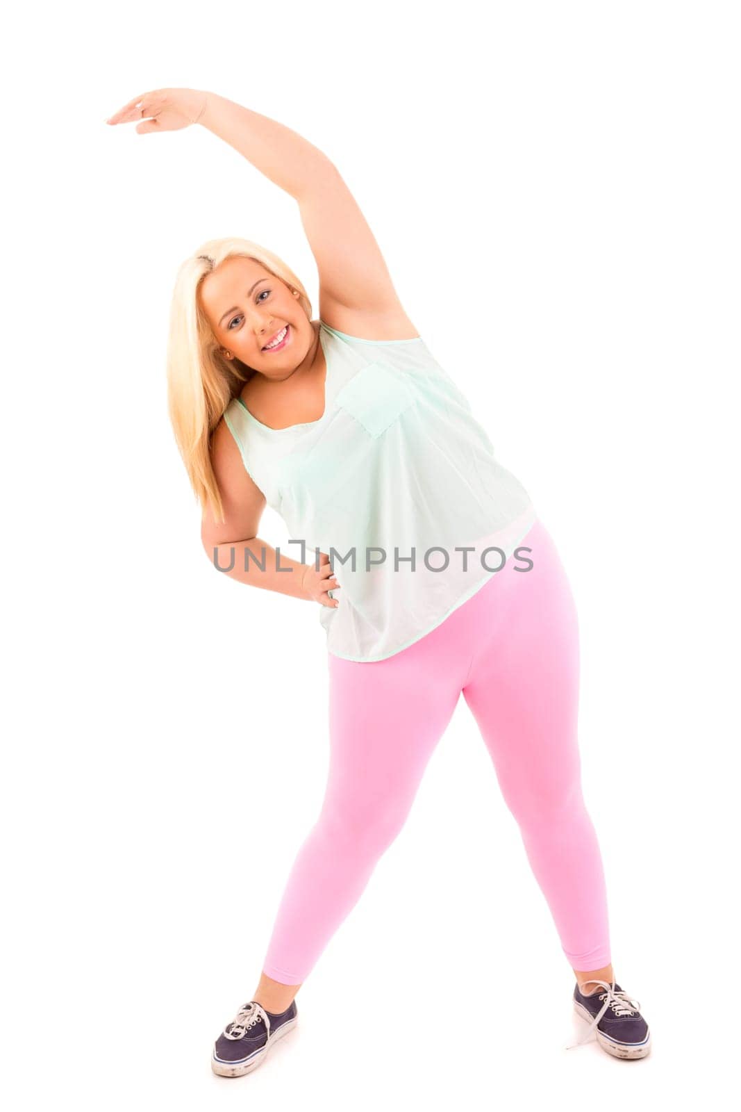 Beautiful large woman exercising - isolated over a white background