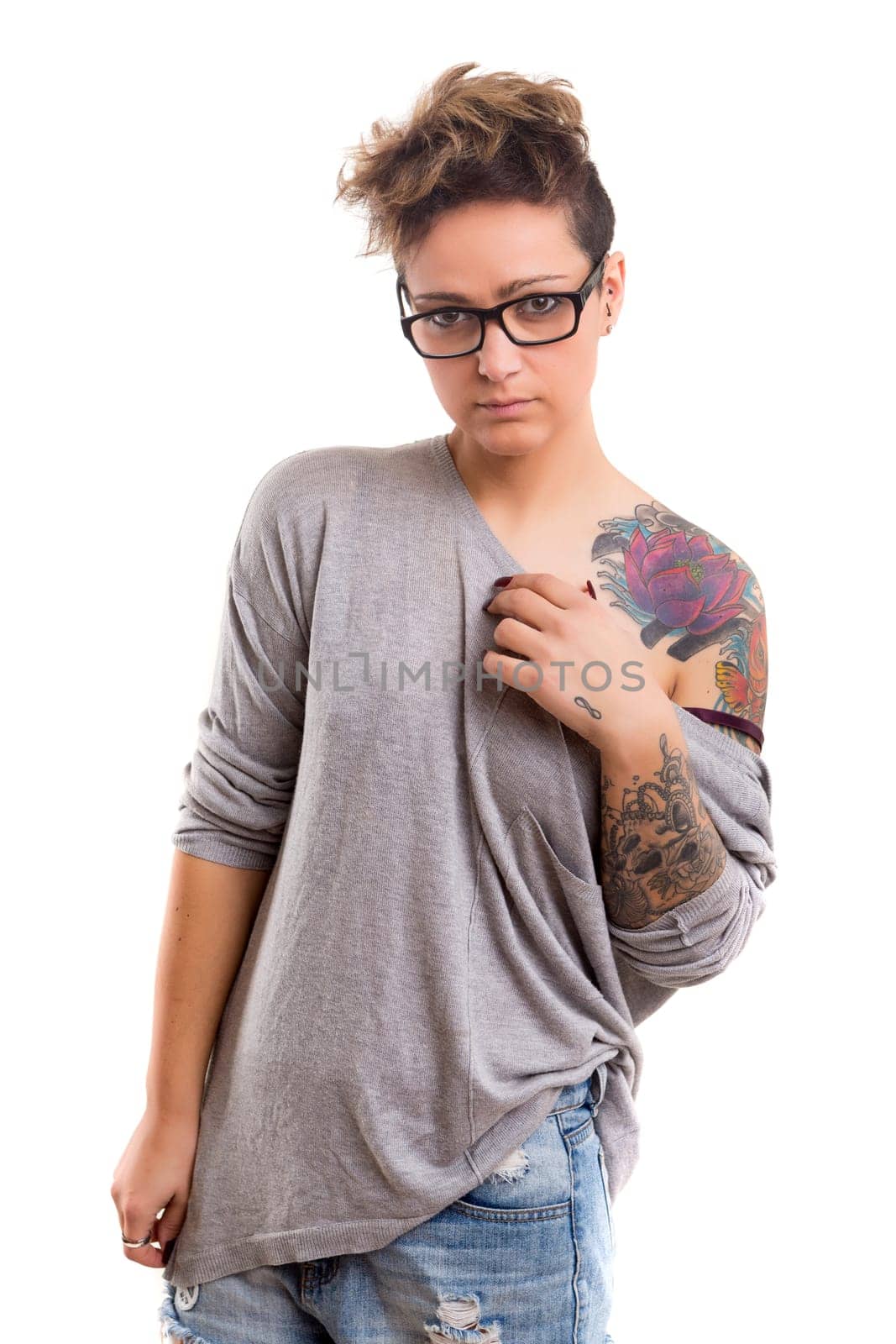 Studio shot of a young tattooed woman