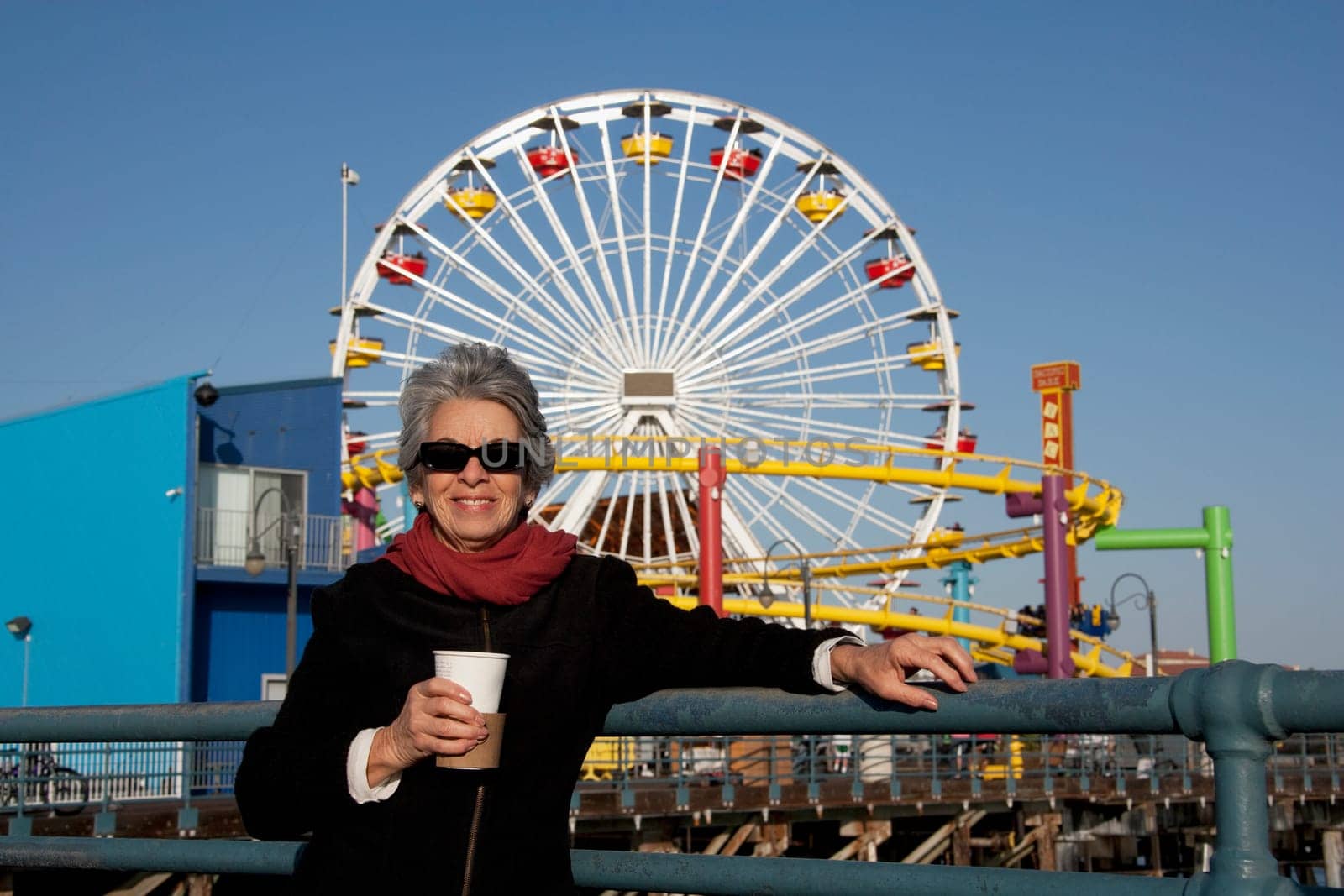 Woman holding a drink in an amusement park, Santa Monica Pier, Santa Monica, Los Angeles County, California, USA