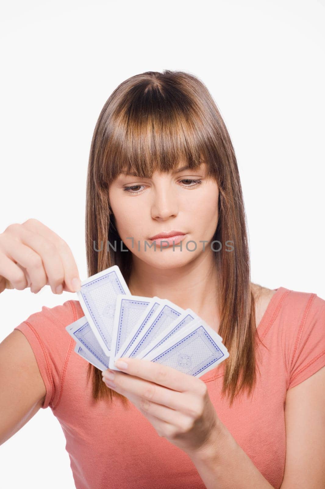 Close_up of a young woman playing cards