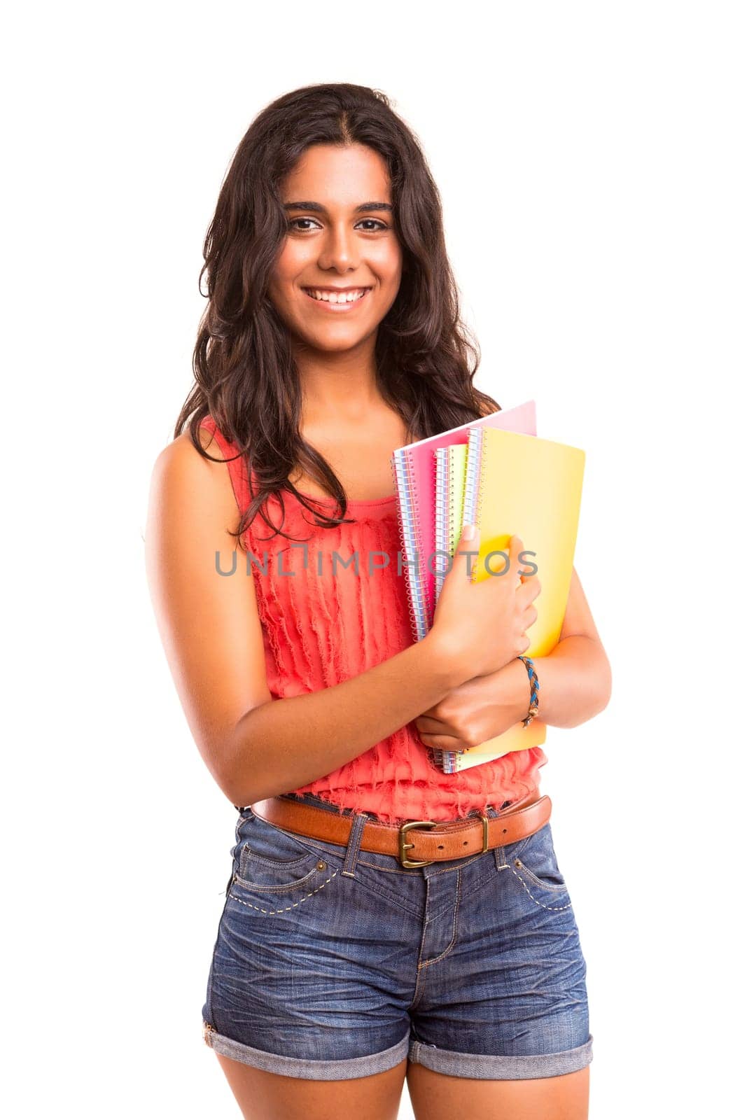 Young and beautiful student posing isolated over white