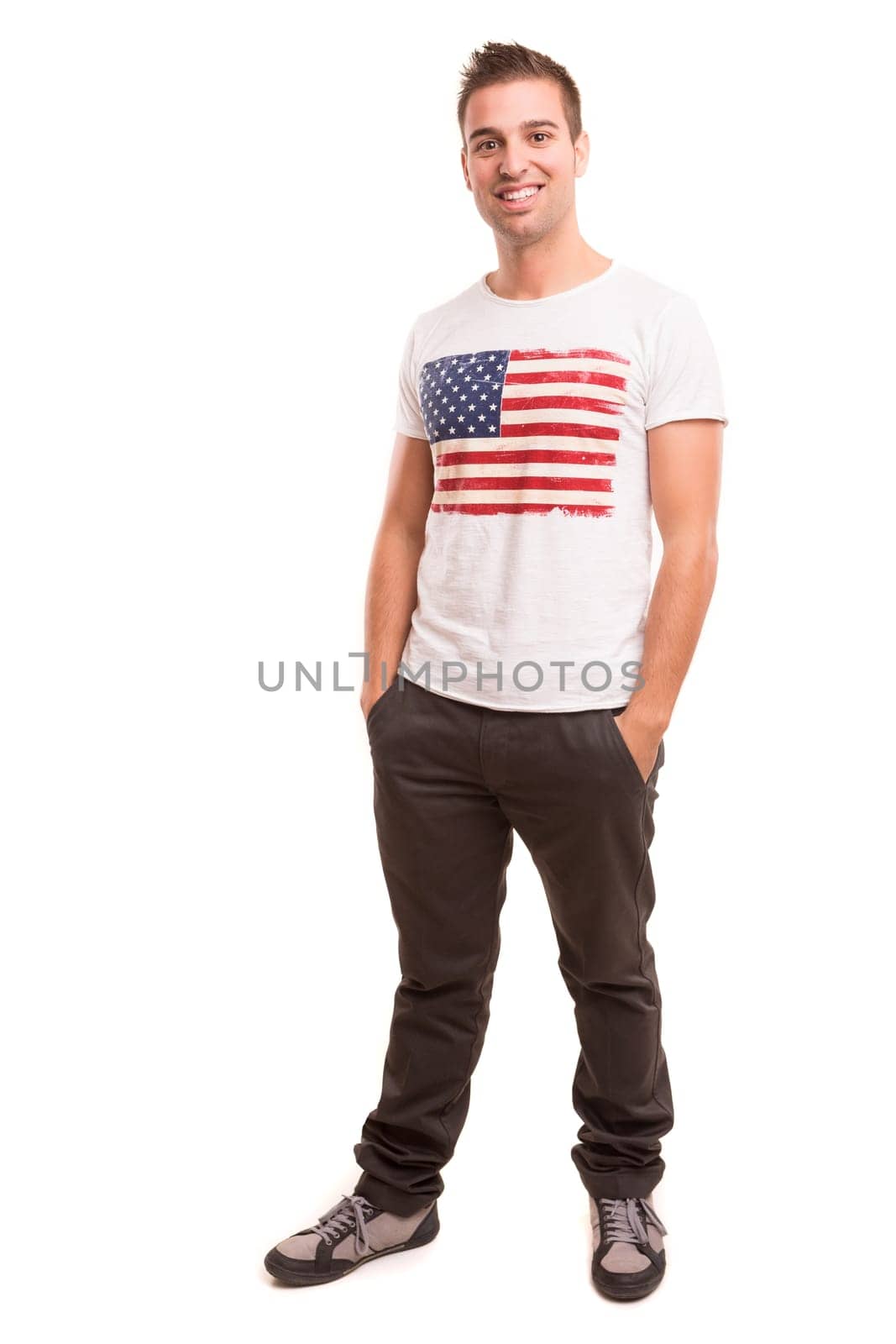 Studio picture of a young and handsome man posing isolated