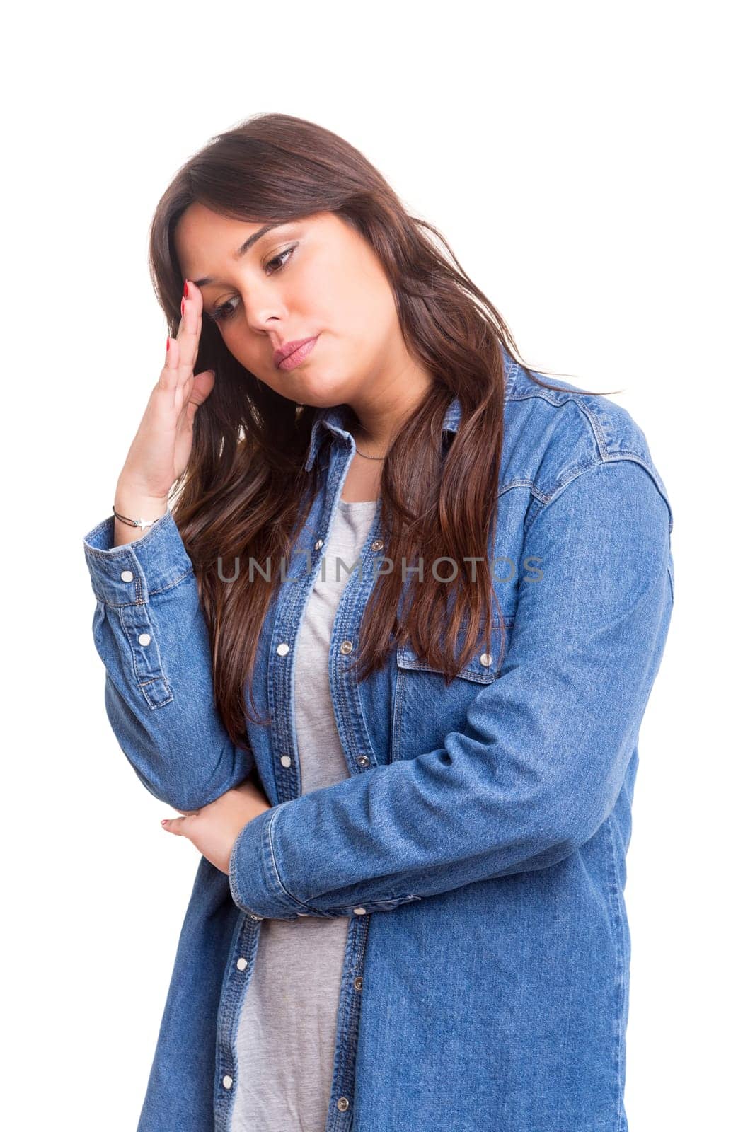 Young student tired of studying for the final exams, isolated over a white background