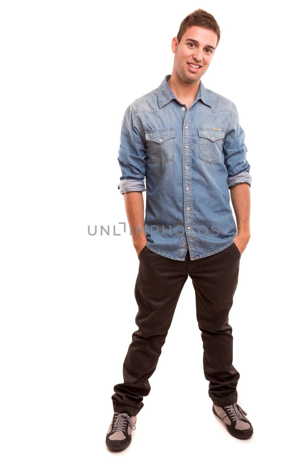 Studio picture of a young and handsome man posing isolated