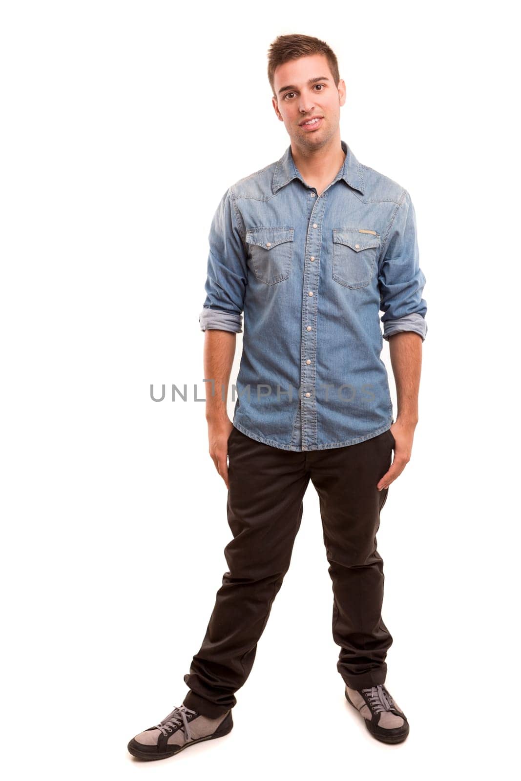 Studio picture of a young and handsome man posing isolated
