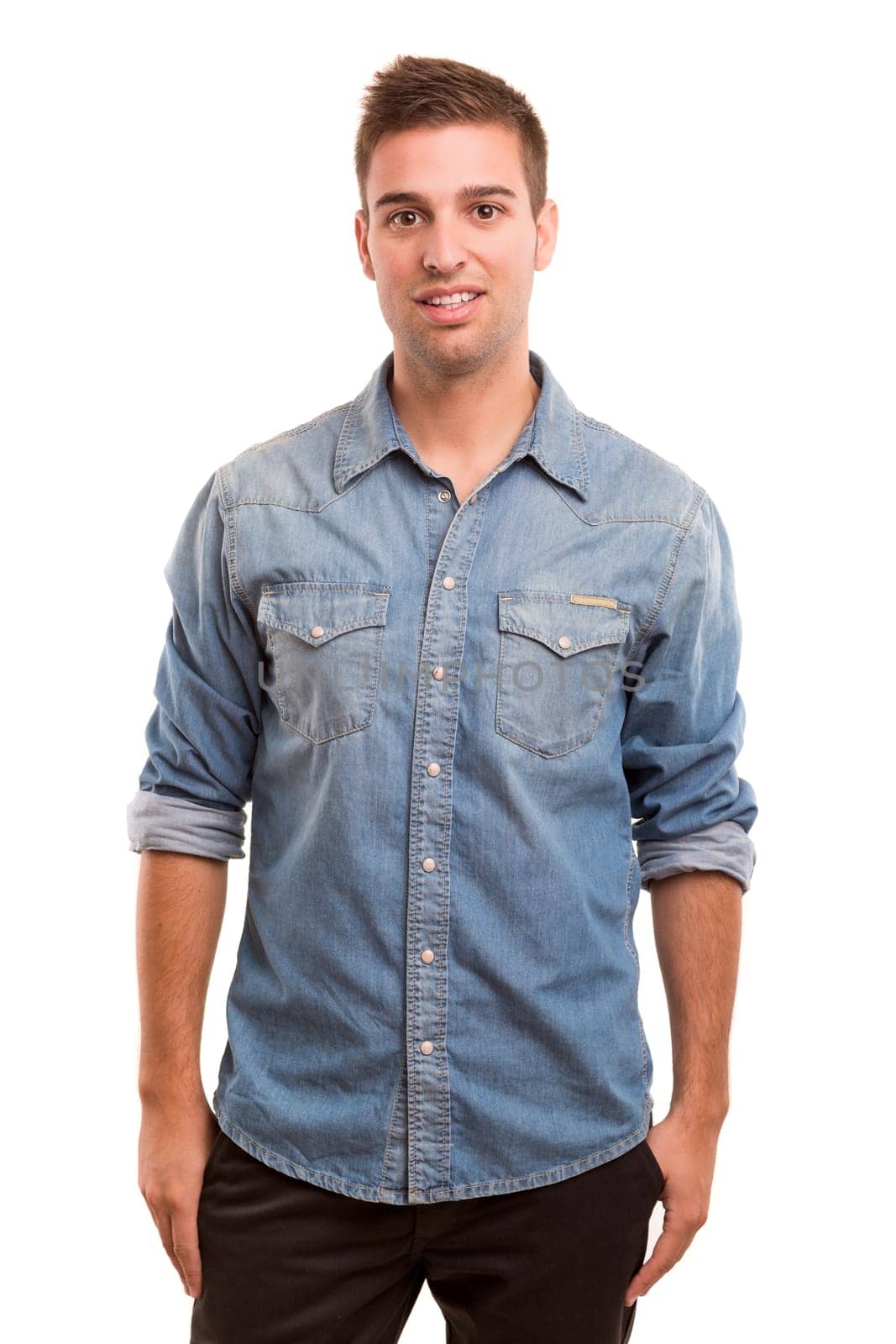 Studio picture of a young and handsome man posing isolated