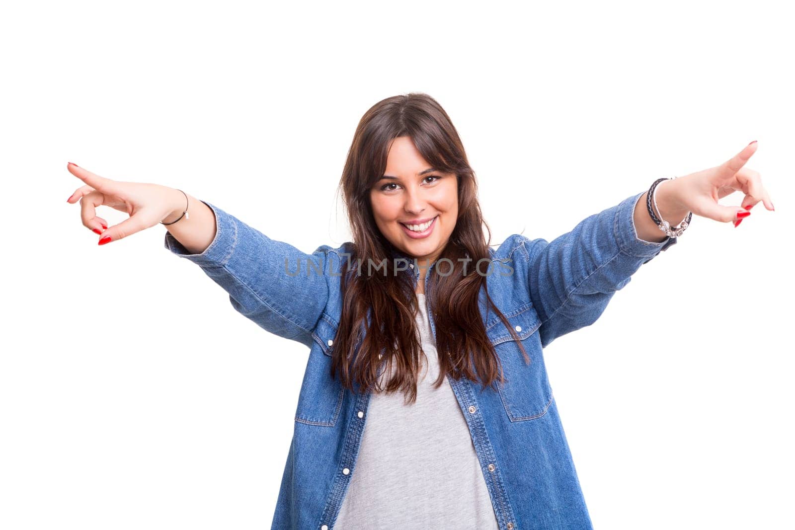 Young beautiful woman presses key, isolated over white