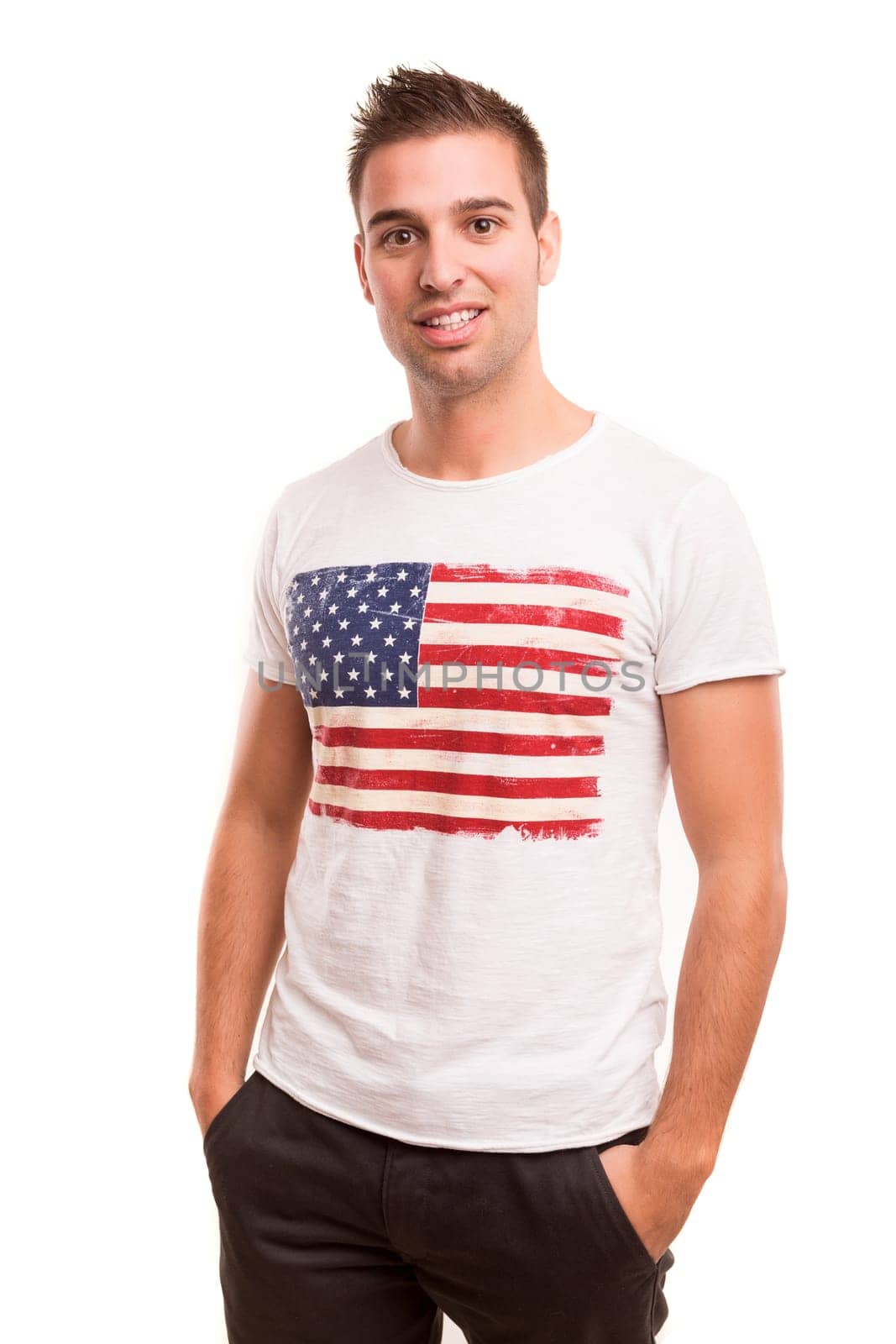 Studio picture of a young and handsome man posing isolated