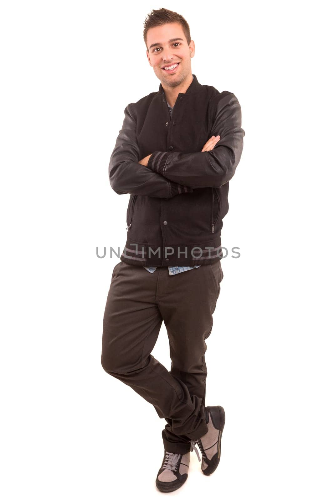 Studio picture of a young and handsome man posing isolated