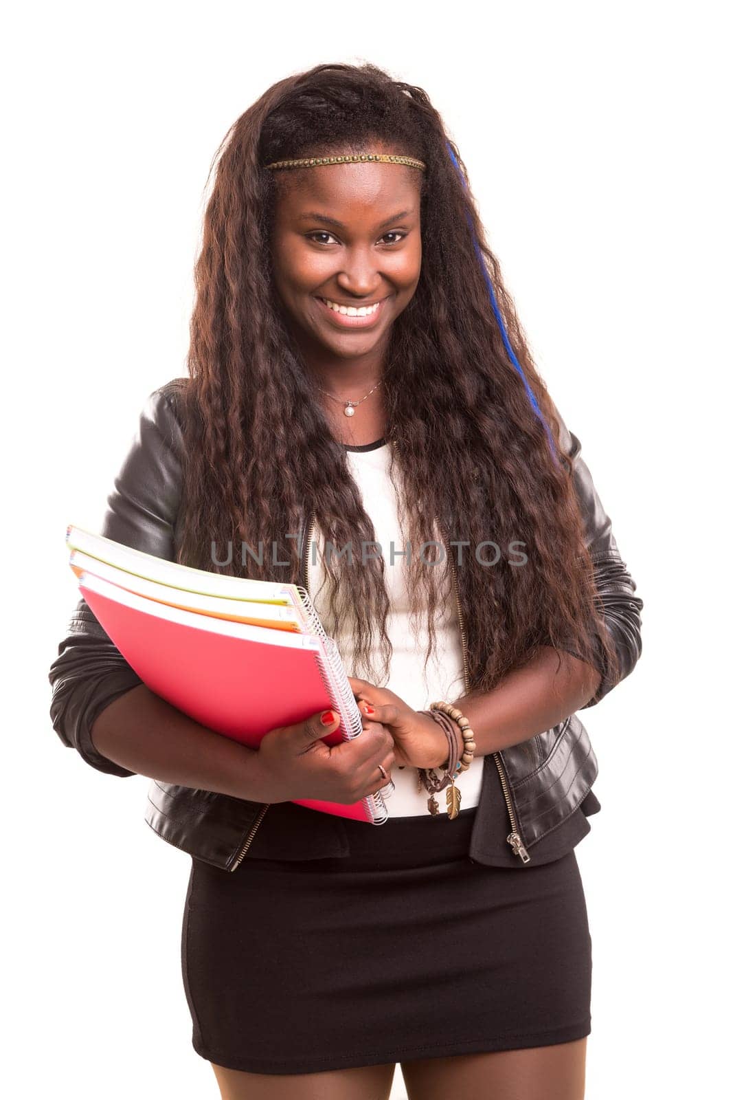 Beautiful african student woman posing isolated over white background