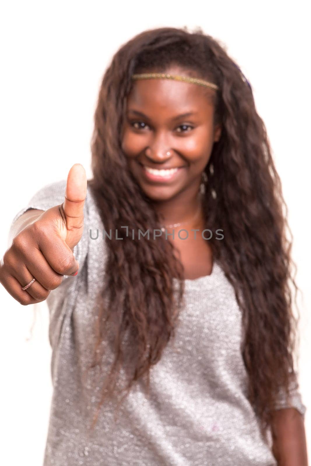 Beautiful young woman signaling ok, isolated over white