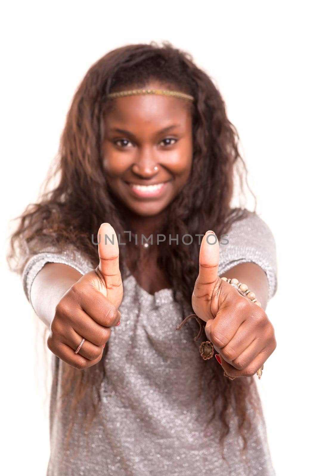 Beautiful young woman signaling ok, isolated over white