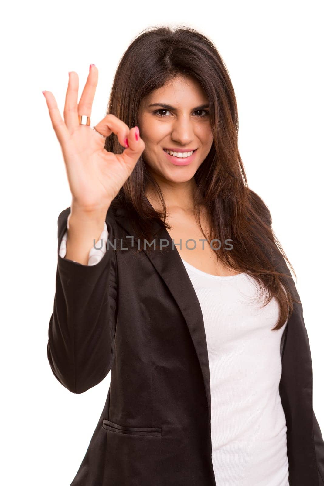 Business woman signaling ok - isolated over white