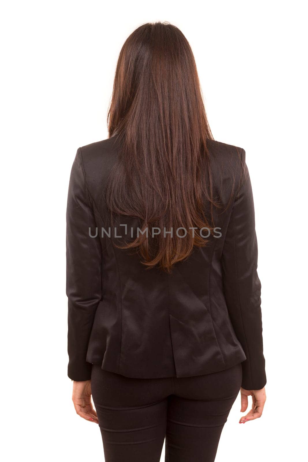 Businesswoman posing with her back faced to camera, isolated over copy space background
