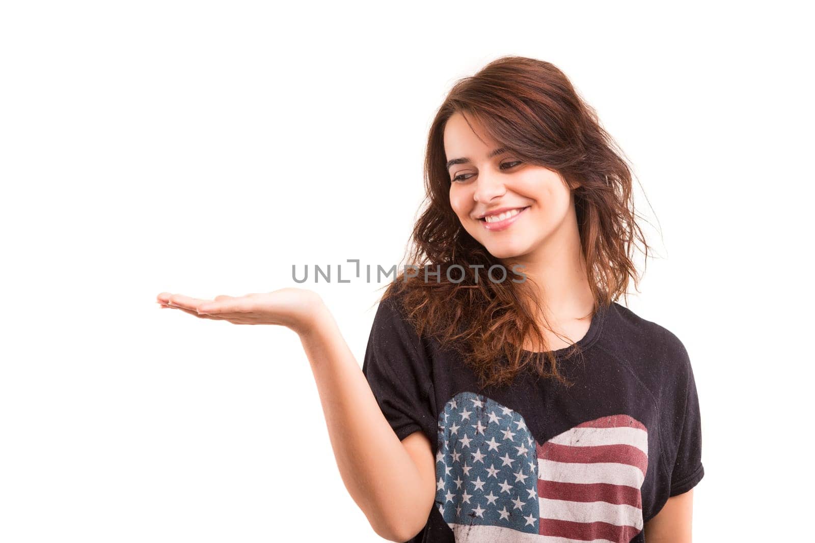 Young beautiful woman presenting your product, isolated over white background