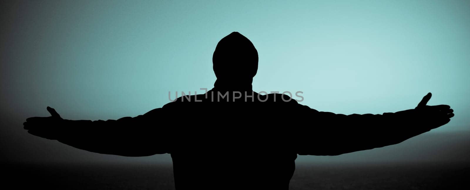 Silhouette of a man standing with his arms outstretched, San Francisco Bay, San Francisco, California, USA