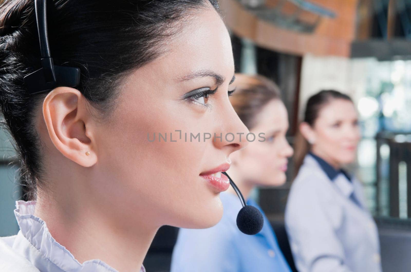 Close_up of a customer service representative wearing a headset