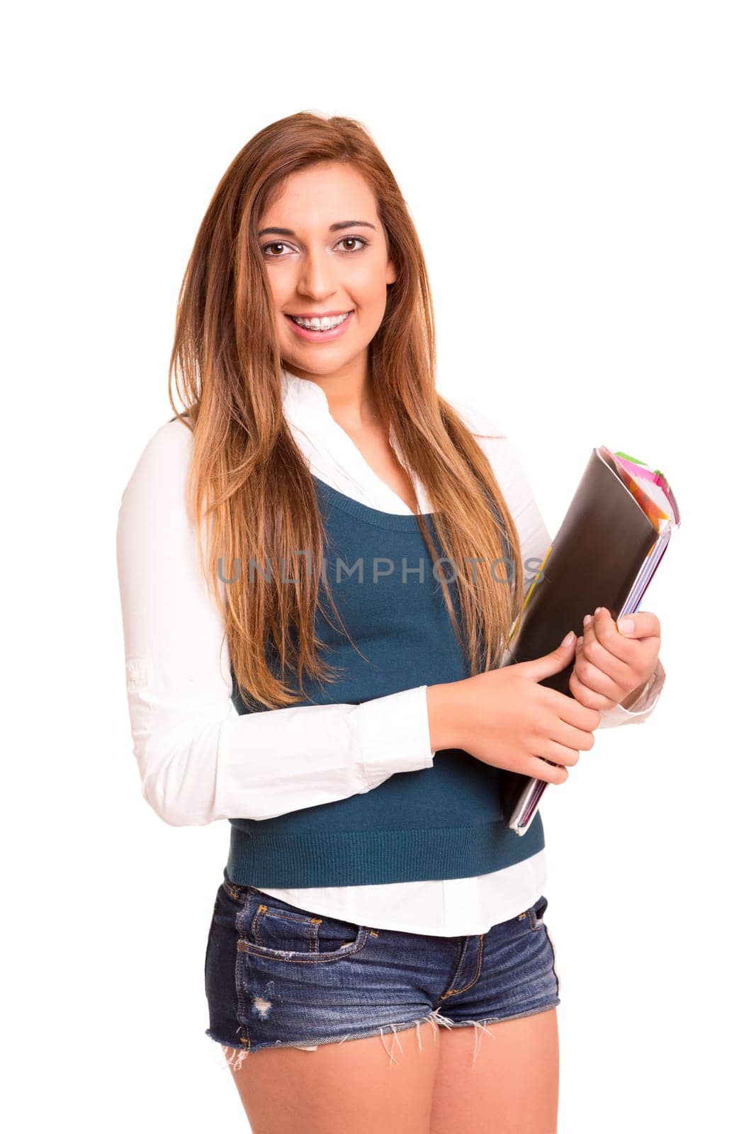Happy teenager wearing braces, posing isolated over a white background