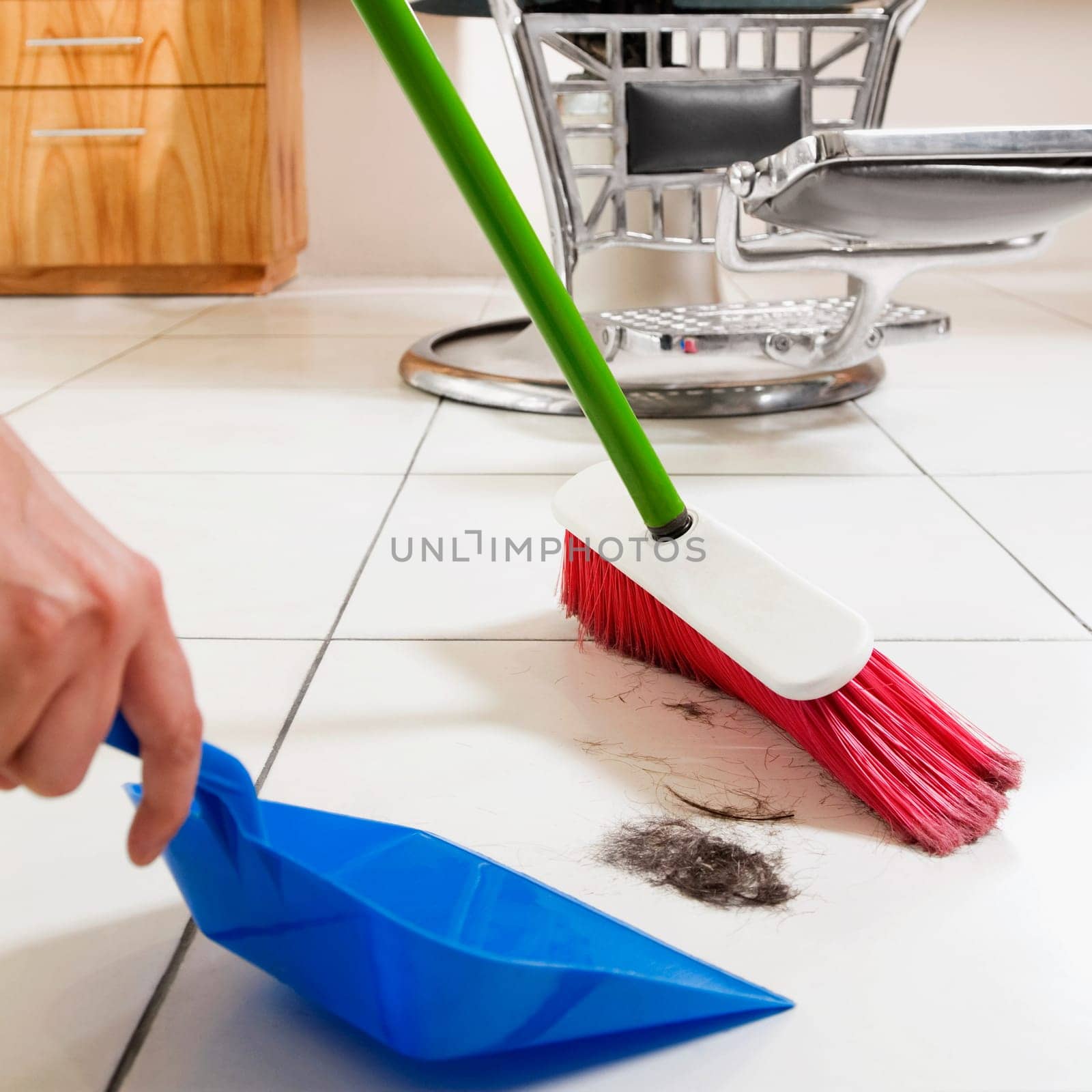 Barber sweeping in a salon