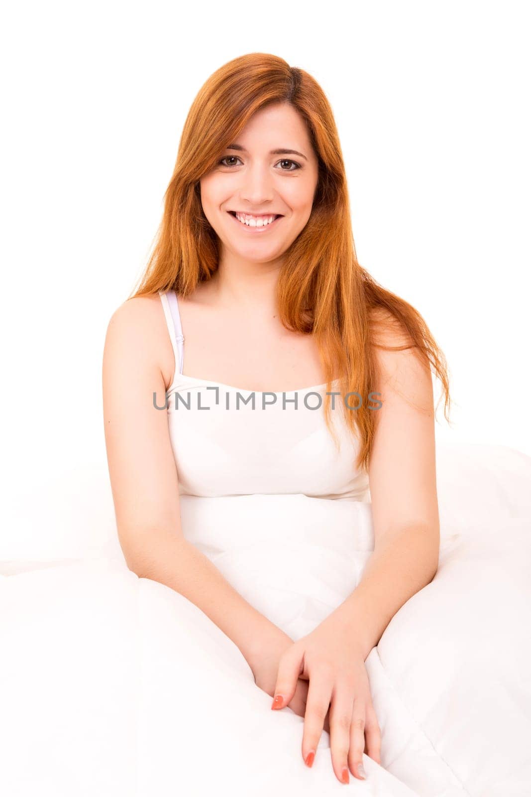 Young happy beautiful woman moments after waking up