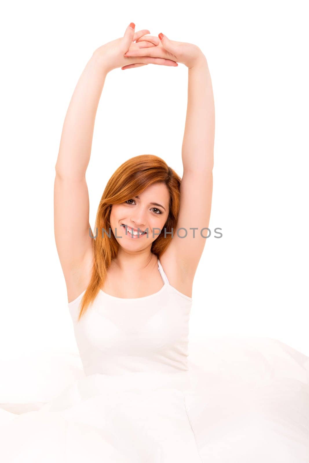 Young happy beautiful woman moments after waking up
