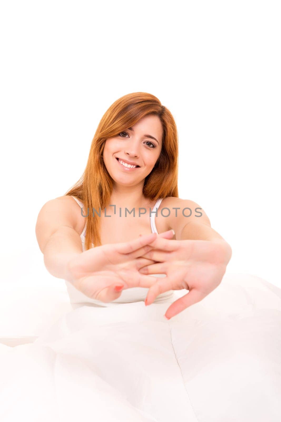 Young happy beautiful woman moments after waking up