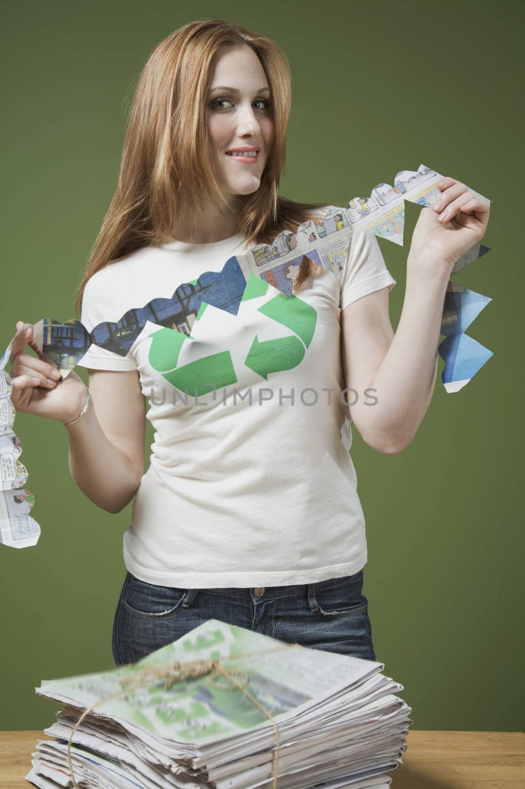 Portrait of a woman holding a heart shaped paper chain