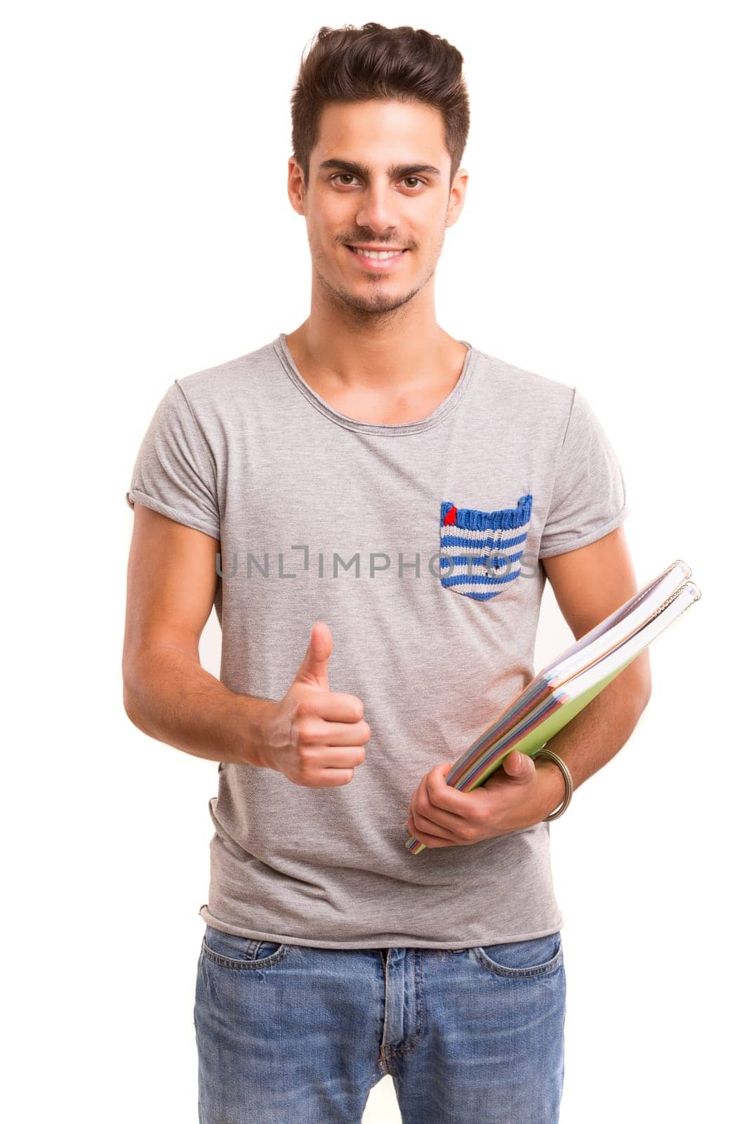 Young happy student posing isolated over white background