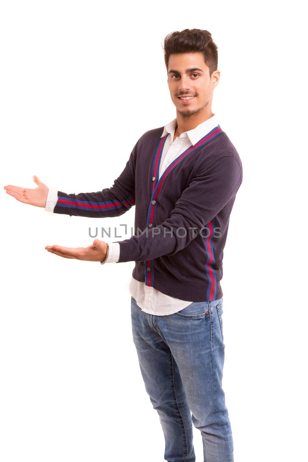 Young man presenting your product, isolated over a white background