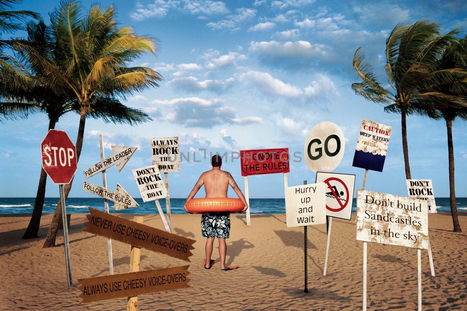 Rear view of a man wearing an inflatable ring and standing on the beach