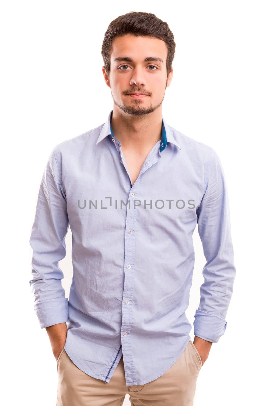 Studio picture of a young and handsome man posing isolated