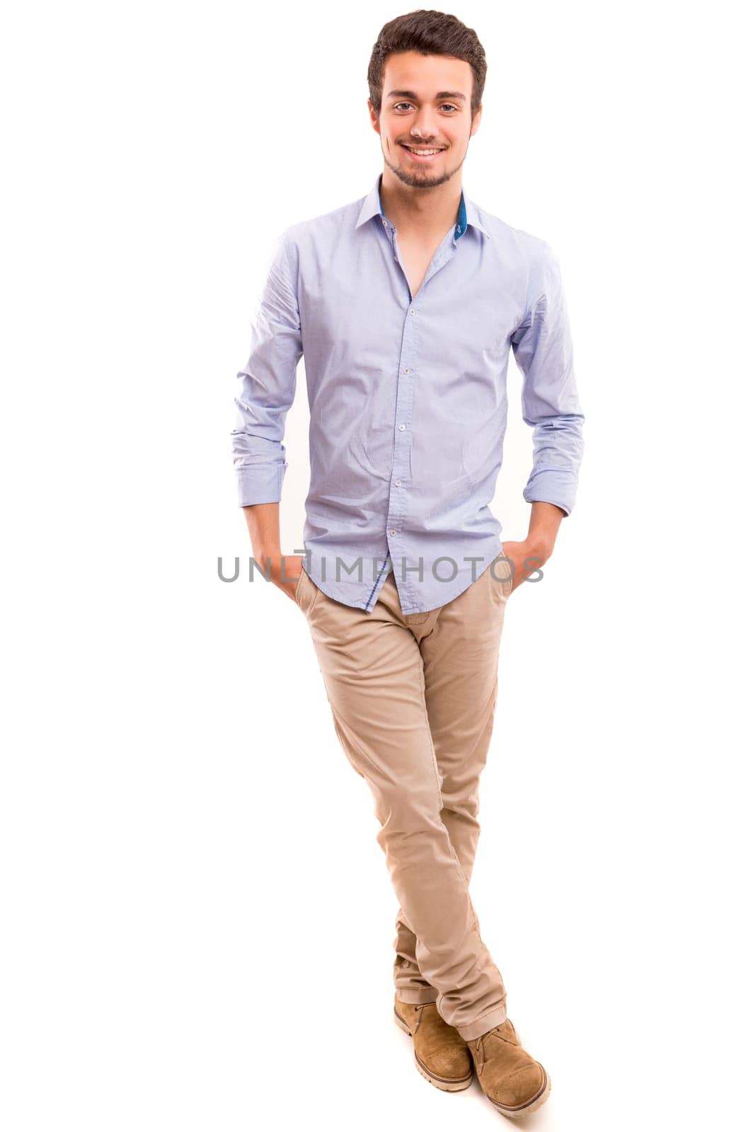 Studio picture of a young and handsome man posing isolated