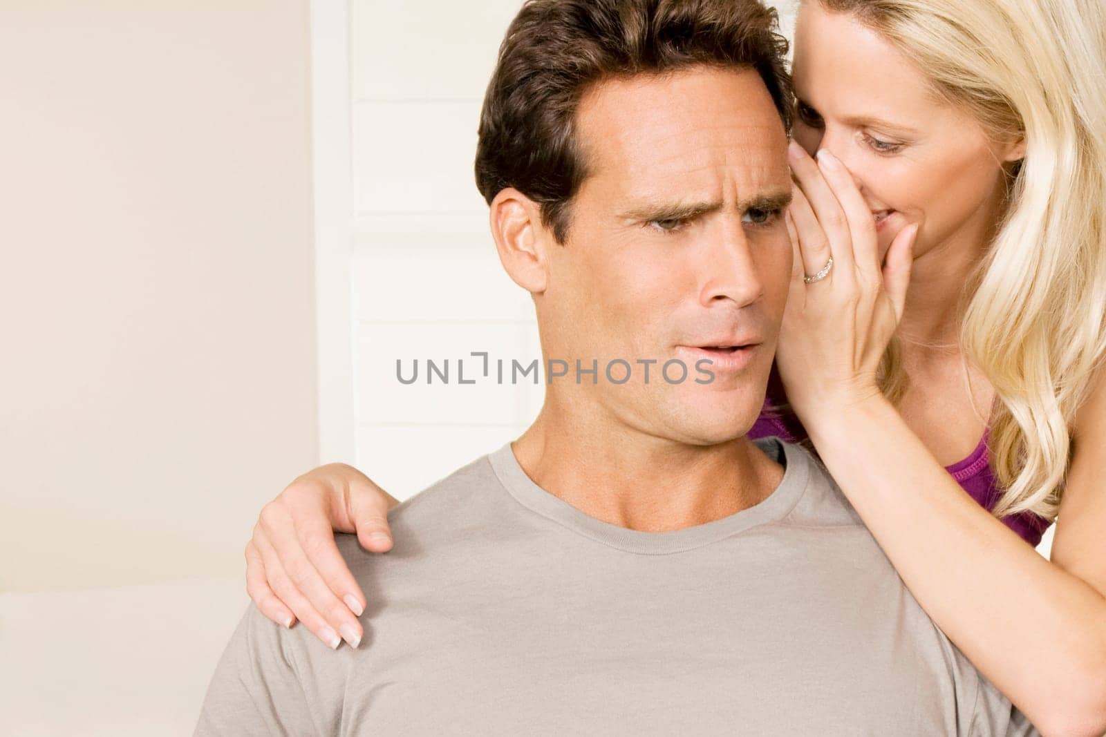 Woman whispering to a man