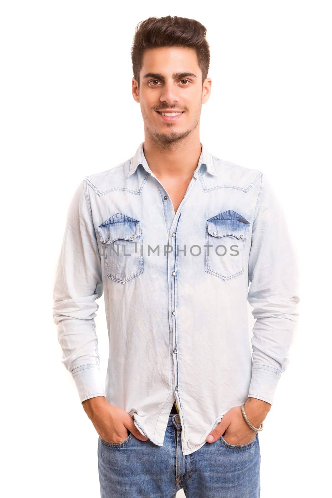 Studio picture of a young and handsome man posing isolated