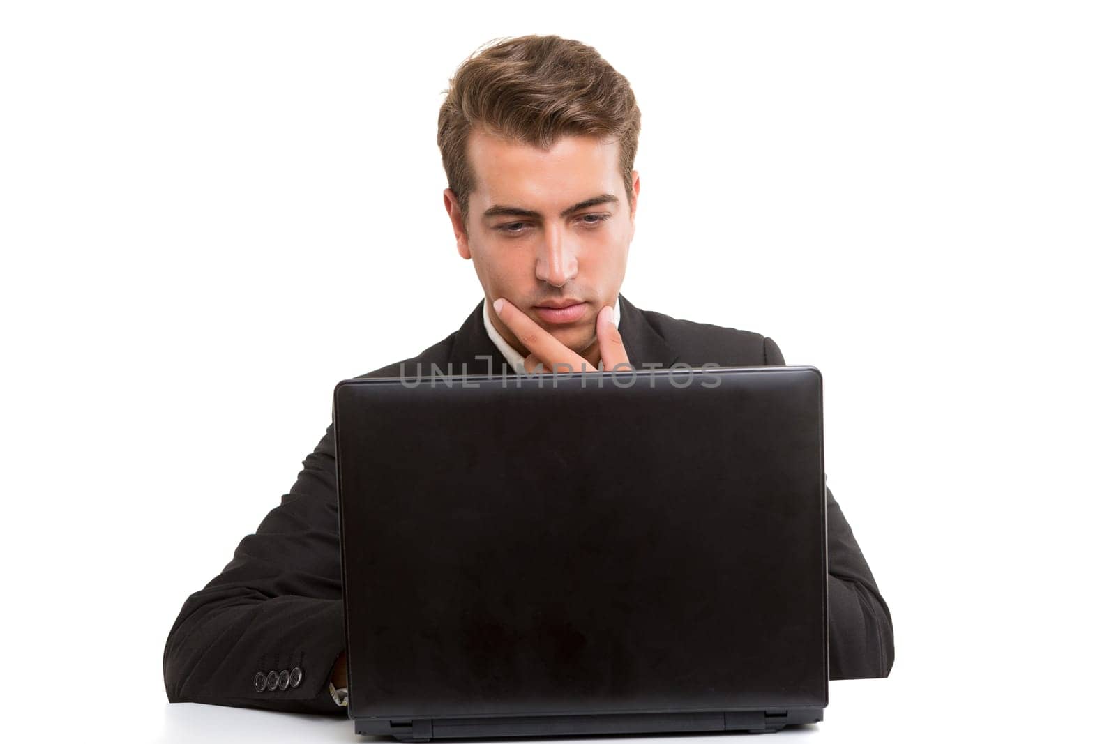 Young handsome man working with laptop computer