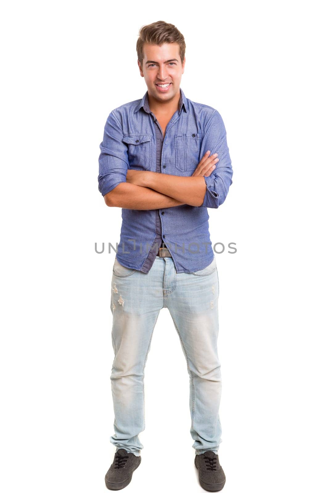 Studio picture of a young and handsome man posing isolated