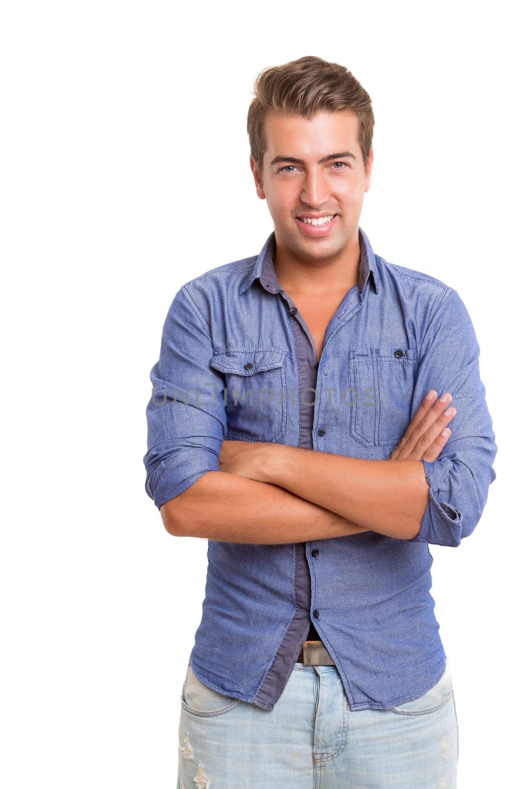 Studio picture of a young and handsome man posing isolated