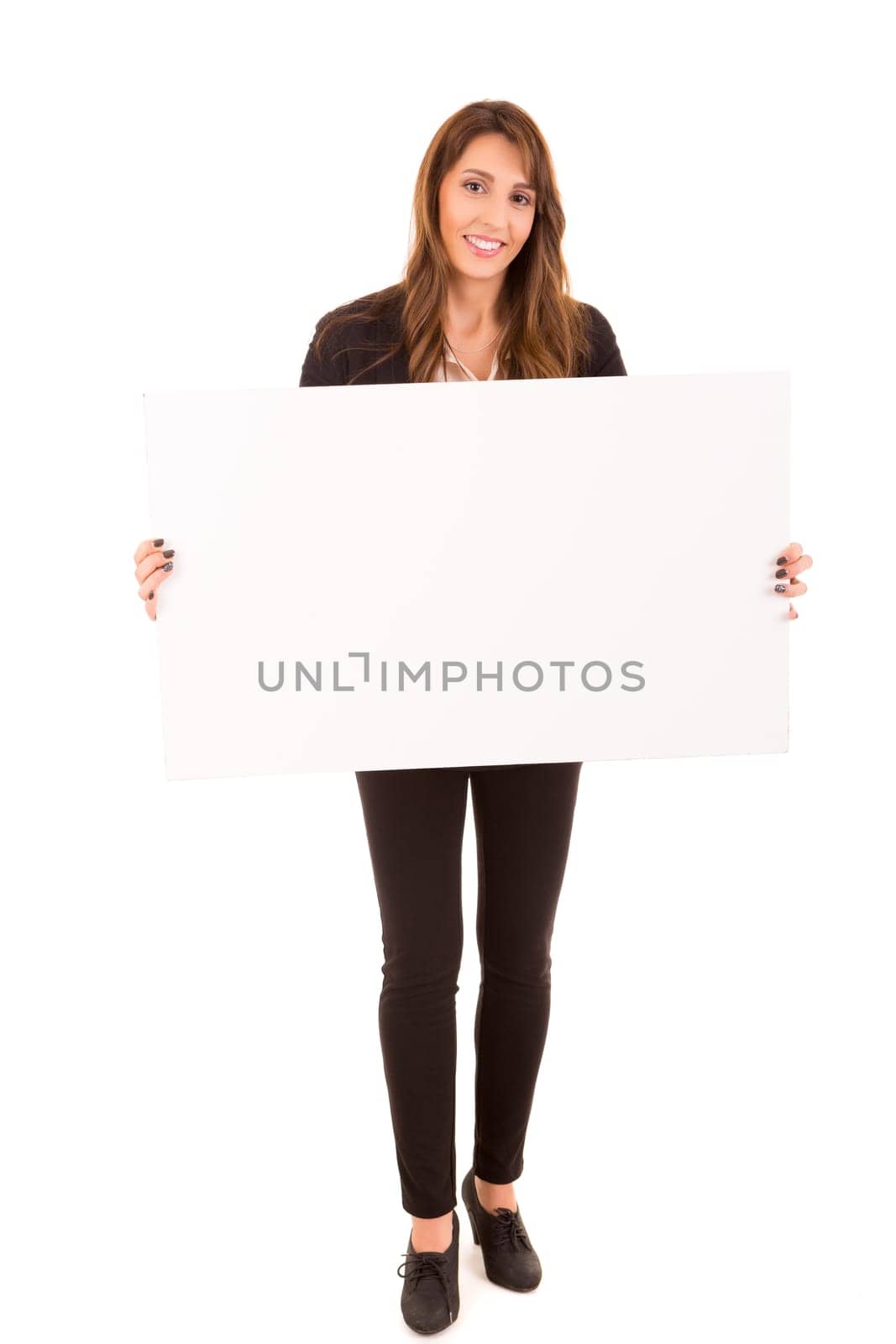 Beautiful young woman holding a white card - isolated over white